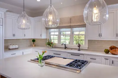 Walnut Island in a White Designer Kitchen by Greenbrook Design Center