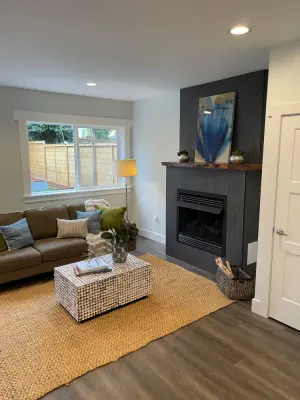 Bespoke Madrona Fireplace Mantel with Contemporary Tile Surround by Emerald City Custom Cabinets