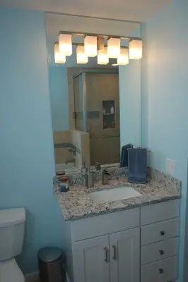 Auburn, MI Custom Tile Alcove Bathroom Renovation by Tri-City Remodeling & Nowak Cabinets