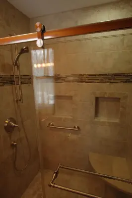 Tailored Tile Shower with Sliding Door - Midland, MI by Tri-City Remodeling & Nowak Cabinets