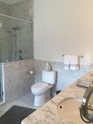 Tailored White and Grey Master Bathroom by Callier & Thompson Kitchens, Baths And Appliances