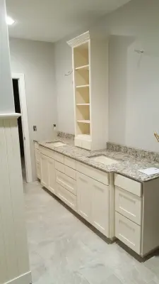 Tailored White Double Vanity with Tower by Straight Edge Construction Group