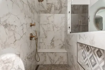 Deerfield Creek Primary Bathroom by Detailed Interiors Inc.