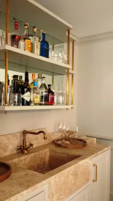 Bar area in the dining room by Belle Ville Design Build