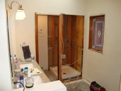 Shower expanded to incorporate a dressing area by Fix Spokane