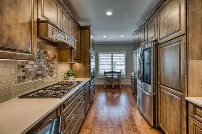 Cozy and Inviting Lorton Kitchen and Basement by Foster Remodeling Solutions, Inc.