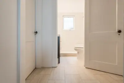 Northside 1920s Bungalow - Bathroom Renovation by Analog HTX