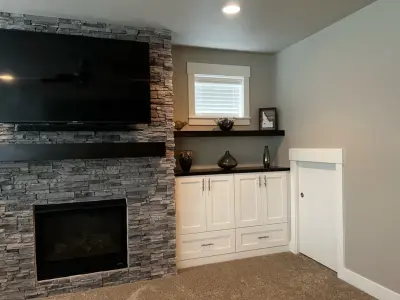 Media Hub with Fireplace by CCH Design | Remodel