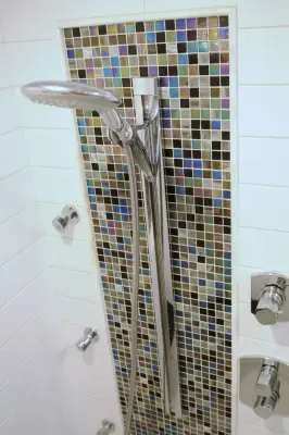 Bathroom in the Family Room by Ballroom Baths & Home Design