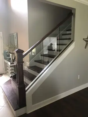 Opulent Staircase Makeover by Elite Construction Of Jax, Inc.