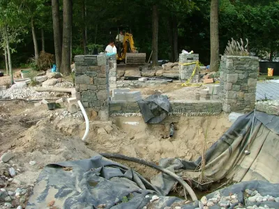 Main driveway with koi ponds on both sides . — Landscape Design project by Koi Villa Water Garden Center