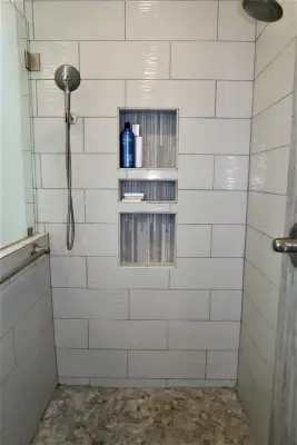 Primary Bathroom and Wardrobe by Infinity Construction, Llc.