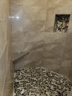 Primary shower by Empire Homes And Remodeling Inc.