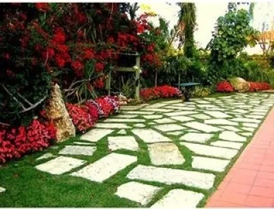 Hidden Garden with Oolite Flooring by Amazing Outdoors Miami