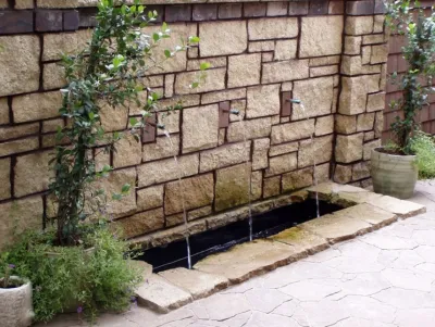 Salina, KS Courtyard Privacy Wall: Water Feature — Landscape Design project by Landscape Consultants LLC in Salina