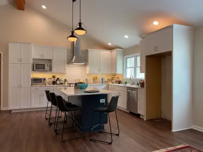 Expanded Kitchen and Family Area with Vaulted Beam Ceiling by HomeStar Renovations