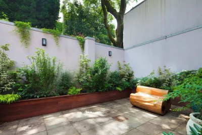 Brooklyn Heights, NYC Backyard Design Bluestone Patio, Bench, Custom Ipe Planter — Landscape Design project by Amber Freda Garden Design in Brooklyn