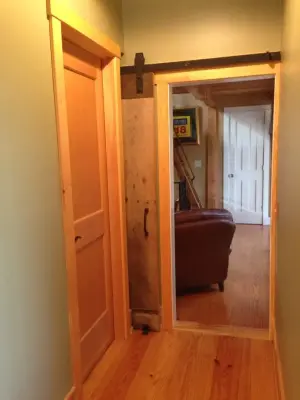 Country-style Sliding Door — Custom Home Builders project by Ingrained Woodworking, Inc.