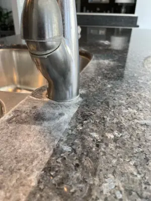Granite countertop mineral deposit extraction — Tile & Stone Installation Services project by The Beautiful Stone Company