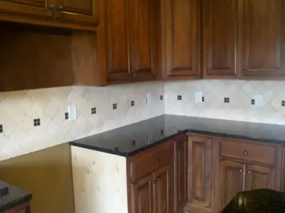 Black Accented Ivory Tumbled Stone by Floor Pro South, LLC