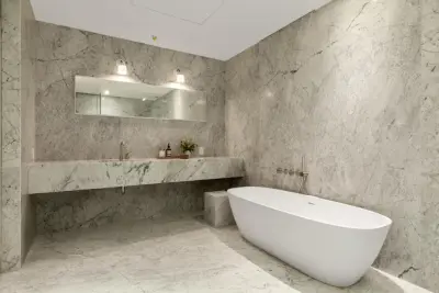 Bathrooms in the Abi Chelsea Building — Tile & Stone Installation Services project by Ultimate Stones Connoisseur