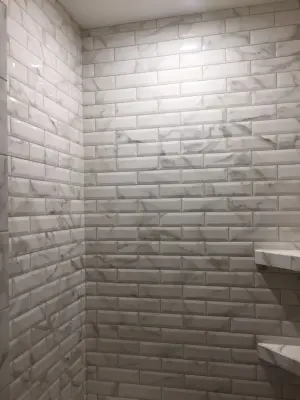 Grey and White Tiled Bathroom — Tile & Stone Installation Services project by The Ceramic Tile Warehouse