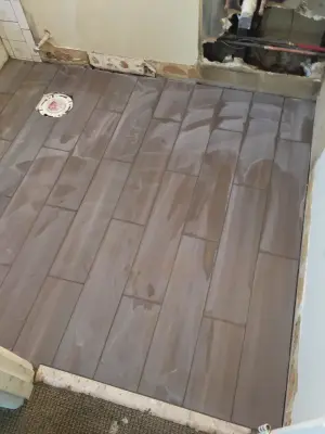 Restroom Flooring — Tile & Stone Installation Services project by TS Tile & Home Repairs