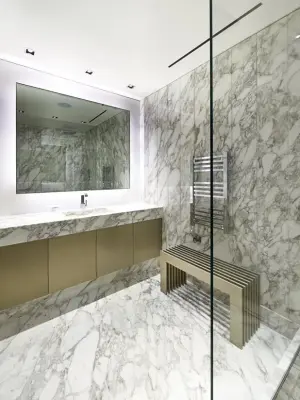 Calacatta Restroom — Tile & Stone Installation Services project by The Stone Gallery