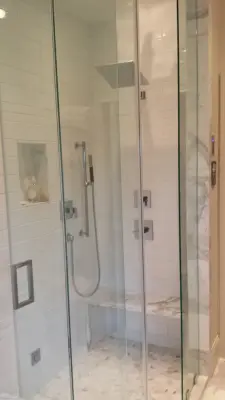 Calacatta Gold Marble Restroom — Tile & Stone Installation Services project by Werthan LLC