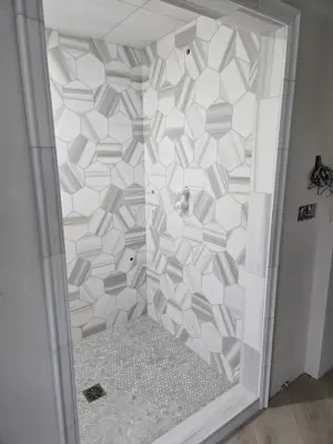 Elm Grove Steam Shower and Flooring — Tile & Stone Installation Services project by Heinrichs Custom Tile And Stone