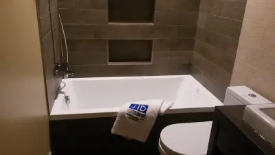 Porcelanosa Tub/Shower Plank Upgrade — Tile & Stone Installation Services project by JD Tile