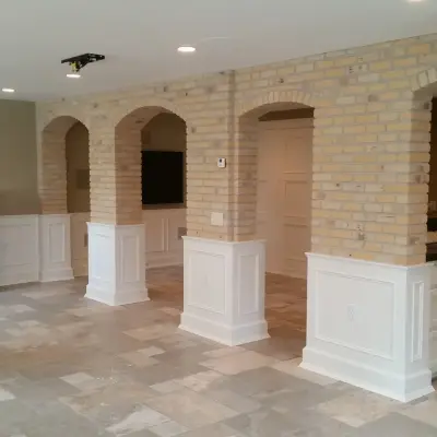 slim brick facade and marble flooring — Tile & Stone Installation Services project by Heinrichs Custom Tile And Stone