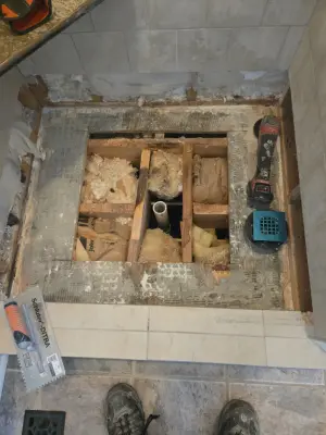 Shower base repair — Tile & Stone Installation Services project by The Professionals