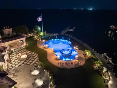 Beautiful Waterfront Residence Featuring Walnut Travertine Pavers and Copings in Long Island — Tile & Stone Installation Services project by NT Pavers