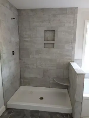 City Coop 100 Shower and Oasis 570 Flooring — Tile & Stone Installation Services project by Wells Tile Company