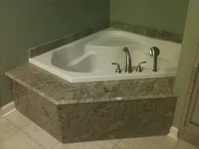 Jet-Equipped Corner Bathtubs — Tile & Stone Installation Services project by Unique Granite & Marble