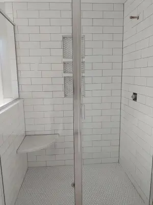 white tile shower — Tile & Stone Installation Services project by Wells Tile Company