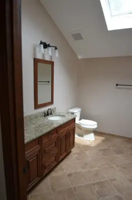 Tailored Master Bathroom Featuring Walk-In Shower by Conrad Kitchen, Bath And Remodeling LLC