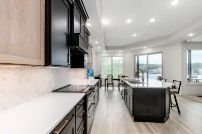 A Kitchen Combining Natural Wood with Striking Black Accents by Your Life Design LLC