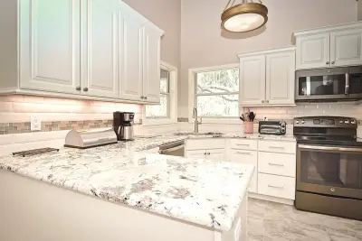An Elegant Open-Plan Kitchen in Bradenton by Gilbert Design Build