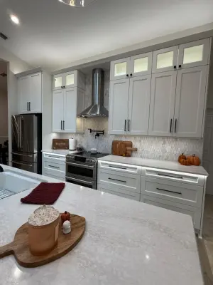 A Beautiful Kitchen Makeover Featuring Timeless White Cabinets by Kitchen Solvers Of The Gulf Coast