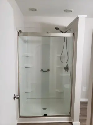 Glass-Enclosed Acrylic Shower by HM Remodeling