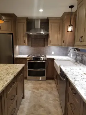Rustic Wood Island Kitchen by Home Run Remodeling & Construction, Inc.