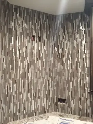 Lower-level lounge flooring and bar wall finish — Kitchen Remodeling project by Master Bath Specialists