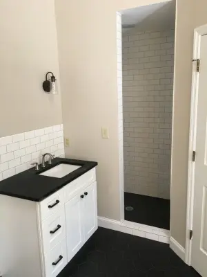 Monochrome Subway Tile for Bathroom by Custom Professional Remodeling, Inc