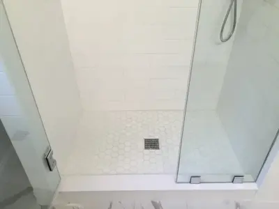 Radiant and Airy Bathroom Renovation by K & M Flooring-Renovations Inc.