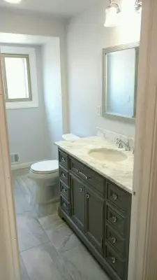 White Marble Vanity in the Bathroom by July's Quality Construction & Remodeling