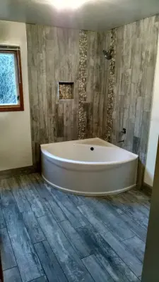 Corner Bath and Shower — Kitchen Remodeling project by July's Quality Construction & Remodeling