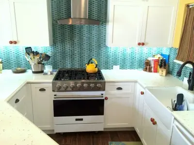 Coastal-Inspired Kitchen Design by Flat Rate Remodeling, Inc.