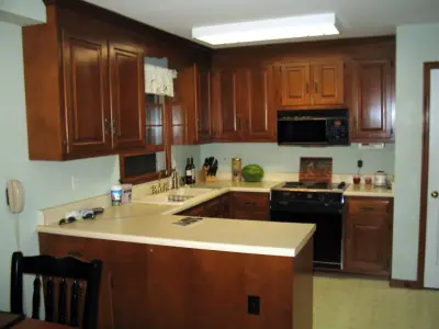 Elegant Kitchen Makeover Executed in Alder with a Honey Finish by Kitchen Solvers Of Grayslake